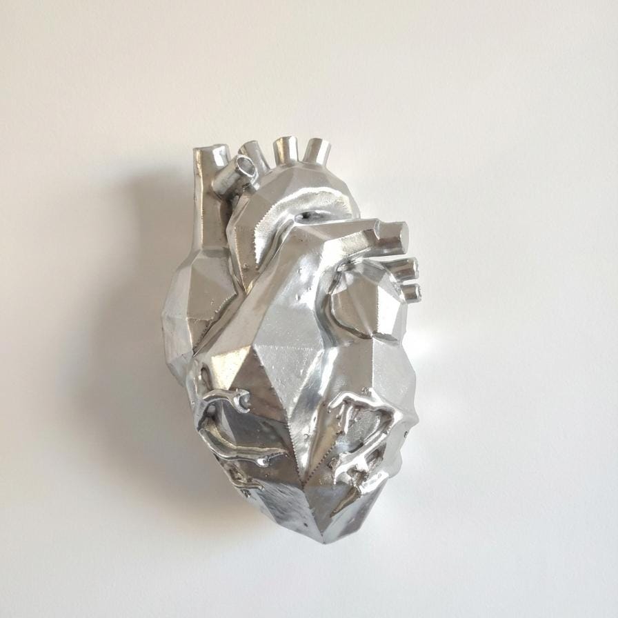 Anatomic silver heart: geometry and light for furnishing